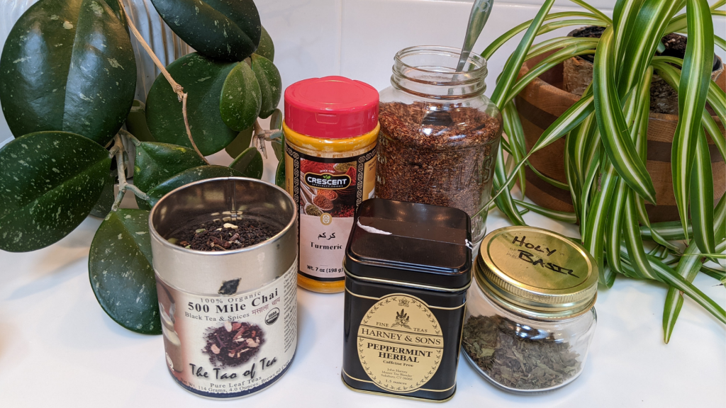 Countertop with 5 best teas for winter and two plants
