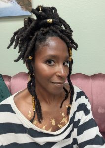 Selfie of woman looking at camera from a slight profile angle