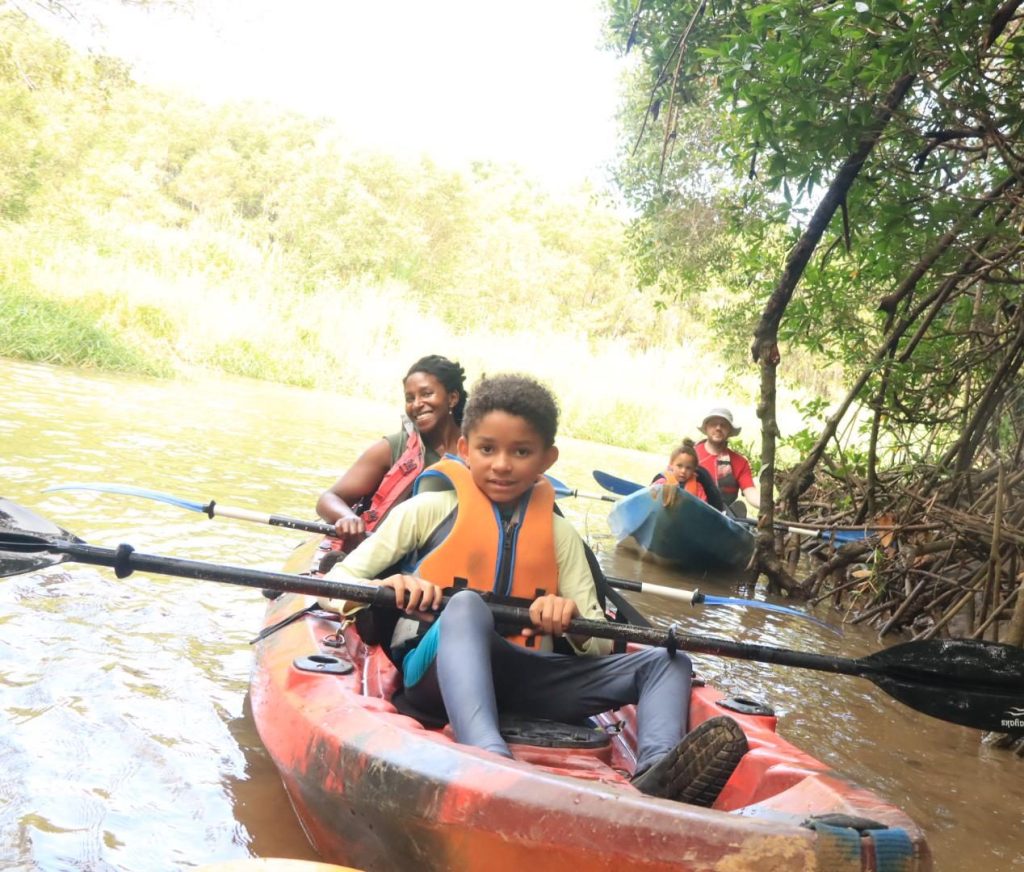 Mom and son kayaking together